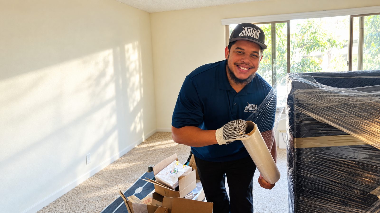 Mama Boy Movers professional wrapping furniture inside a Ventura County home